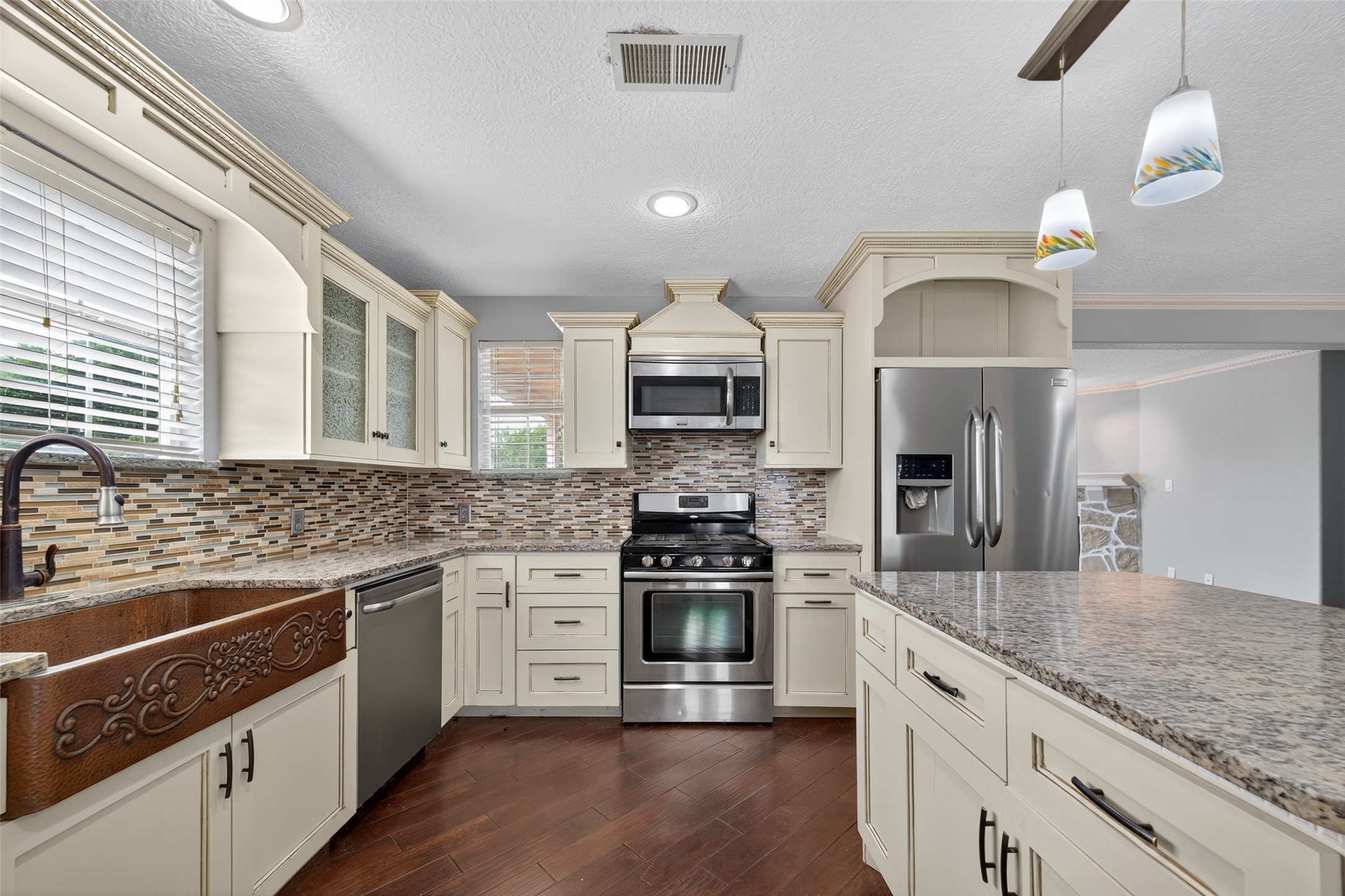 16809 Market Street Channelview, TX 77530 - Photo 9 of 35 a kitchen with stainless steel appliances granite countertop a stove and a sink