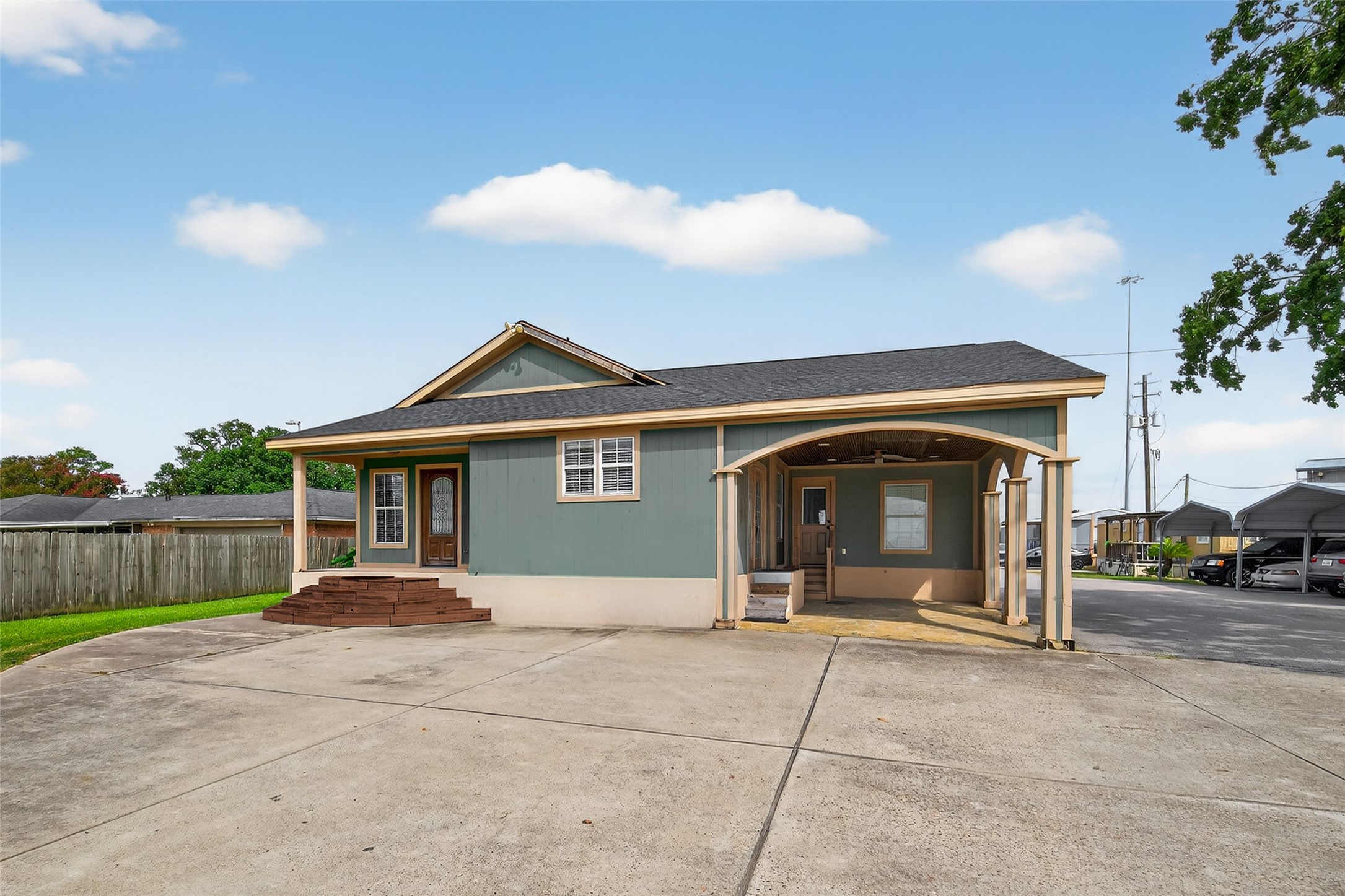 16809 Market Street Channelview, TX 77530 - Photo 10 of 35 a front view of a house with a yard and garage
