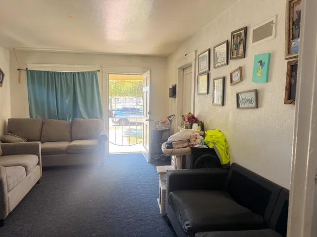 a living room with furniture and a window