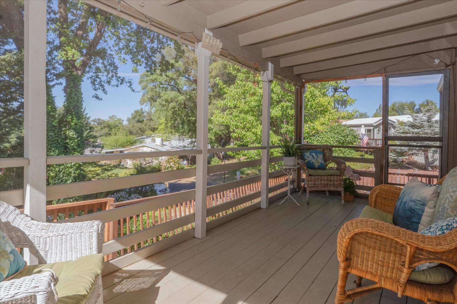 340 Tom Bell Road, Unit 259 Murphys, CA 95247 - Photo 12 of 43 Spacious screened in porch with two access doors. Screened door on right to raised bed garden area. Screened door on left to patio area. Enjoy the ridge views from your quiet backyard oasis.