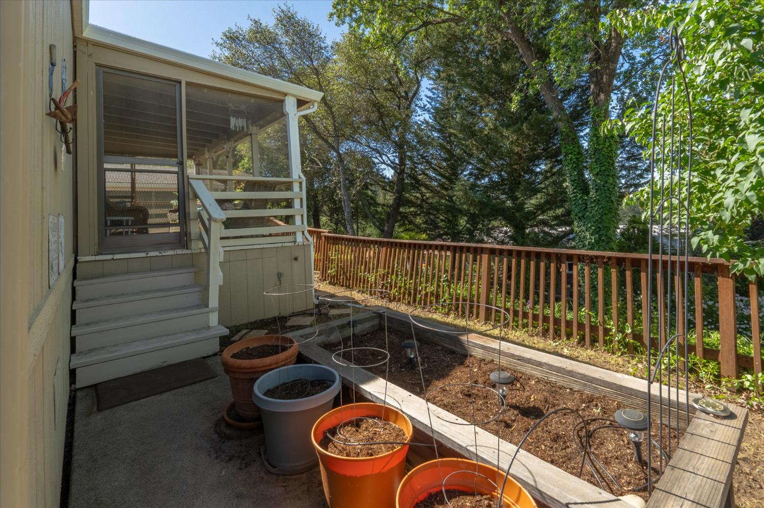 340 Tom Bell Road, Unit 259 Murphys, CA 95247 - Photo 24 of 43 Raised bed garden for easy access gardening in fenced backyard.