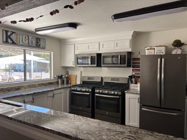 340 Tom Bell Road, Unit 259 Murphys, CA 95247 - Photo 38 of 43 Clubhouse kitchen boasts two ovens & microwaves for food prep and ample counter space and large window pass-through for serving.