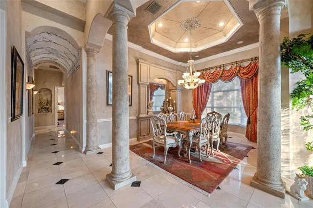 a living room with furniture a rug and white walls