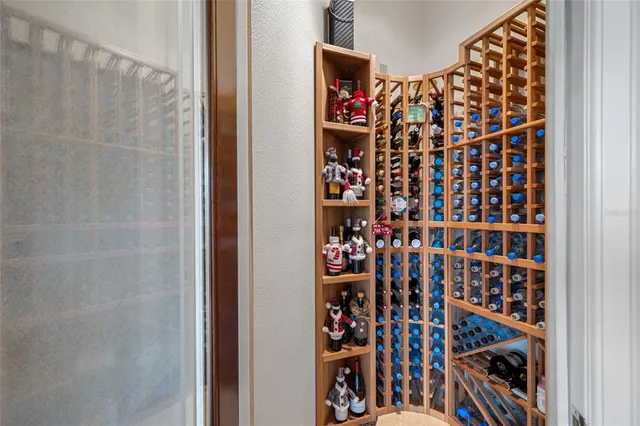 a living room with fireplace furniture and a large window