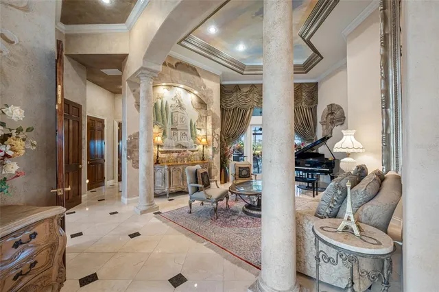 a spacious bedroom with a bed a couch and dresser