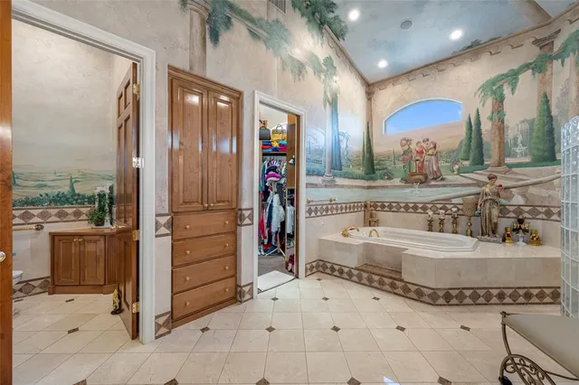 a kitchen with stainless steel appliances granite countertop a stove and cabinets