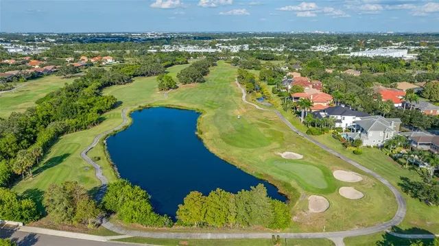 a view of a swimming pool of a house with a yard