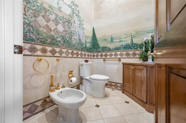 a kitchen with a sink a counter top space and stainless steel appliances