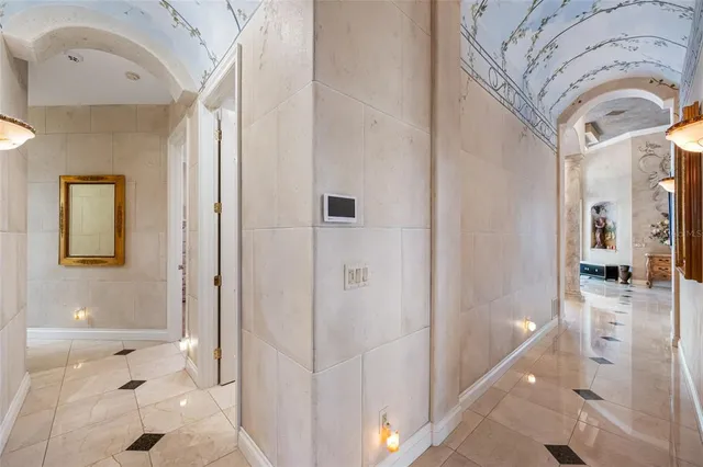 a living room with furniture appliances and a large window