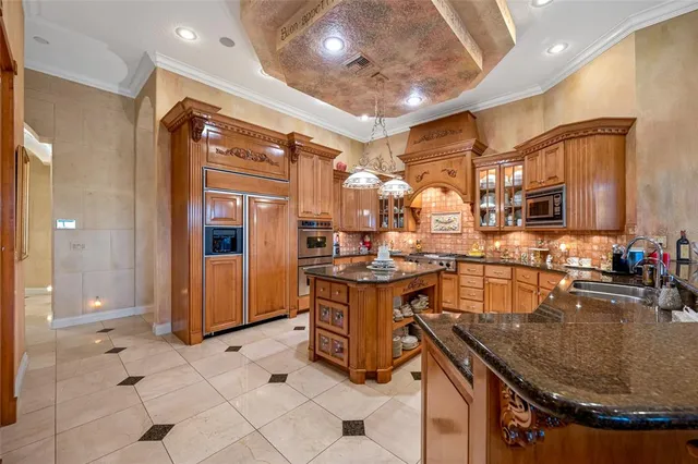 a living room with furniture and large windows