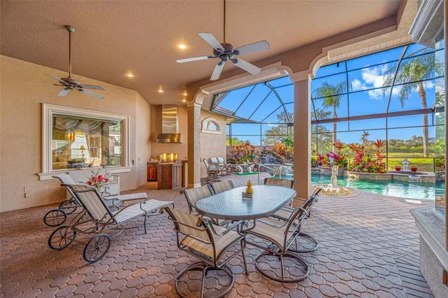 a view of a swimming pool and an outdoor seating