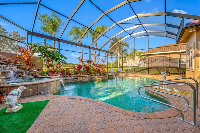 a patio with a table and chairs under an umbrella