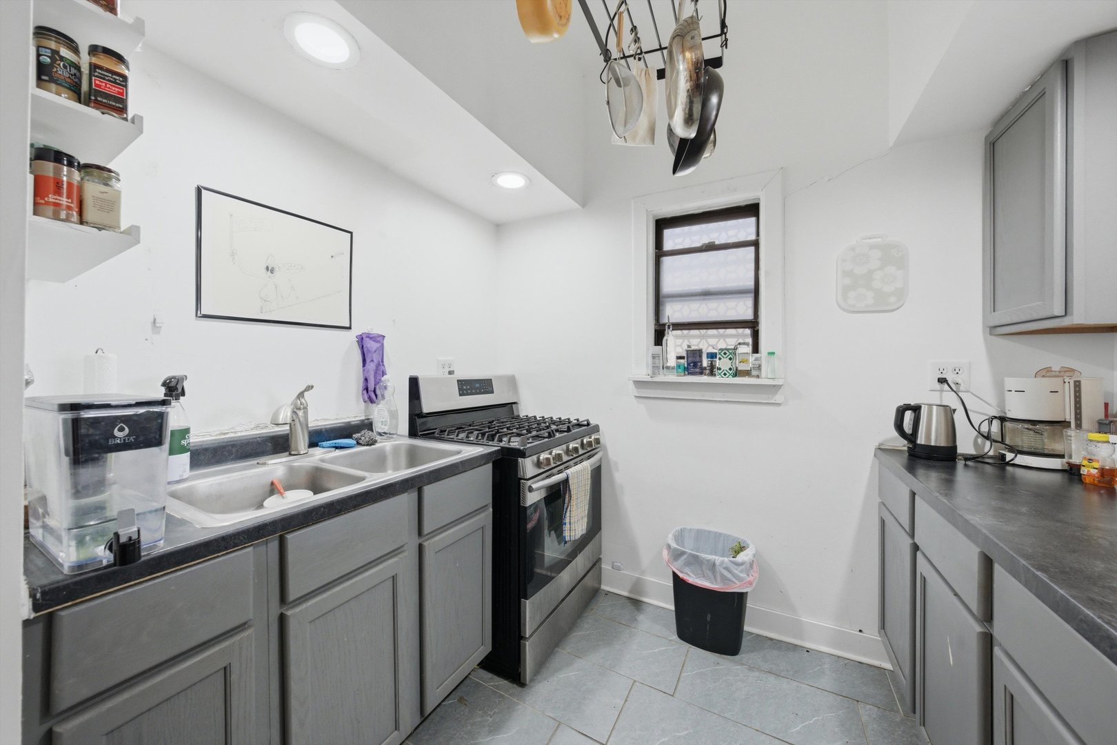 903 West 19th Street, Unit 3 Chicago, IL 60608 - Photo 9 of 16 a bathroom with a granite countertop sink a toilet and a mirror