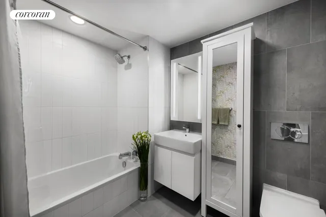 a living room with furniture a bookshelf and a large window