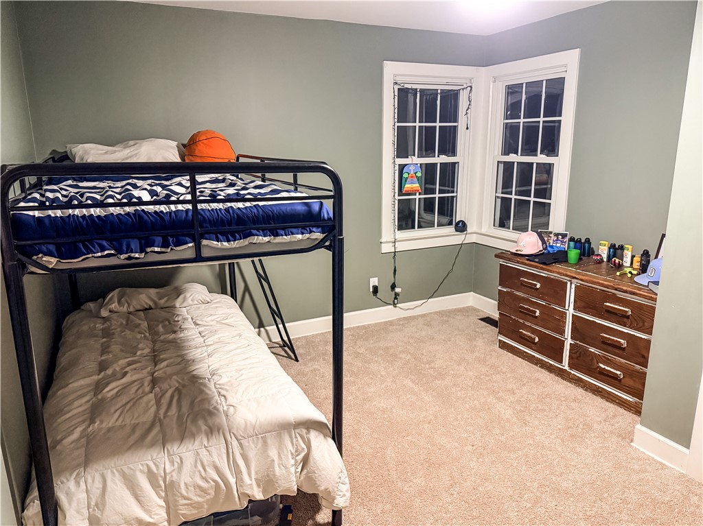 757 Belle Shoals Road Pickens, SC 29671 - Photo 21 of 31 A well-lit bedroom features plush carpeting and multiple windows.