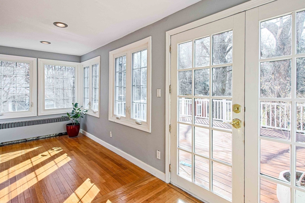 5 Old Brook Drive Worcester, MA 01609 - Photo 20 of 42 a view of an empty room with wooden floor and a window