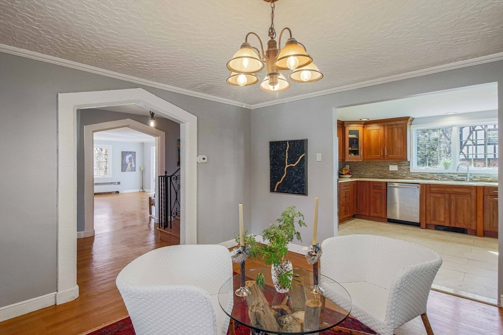 5 Old Brook Drive Worcester, MA 01609 - Photo 22 of 42 a view of a dining room with furniture a chandelier and wooden floor