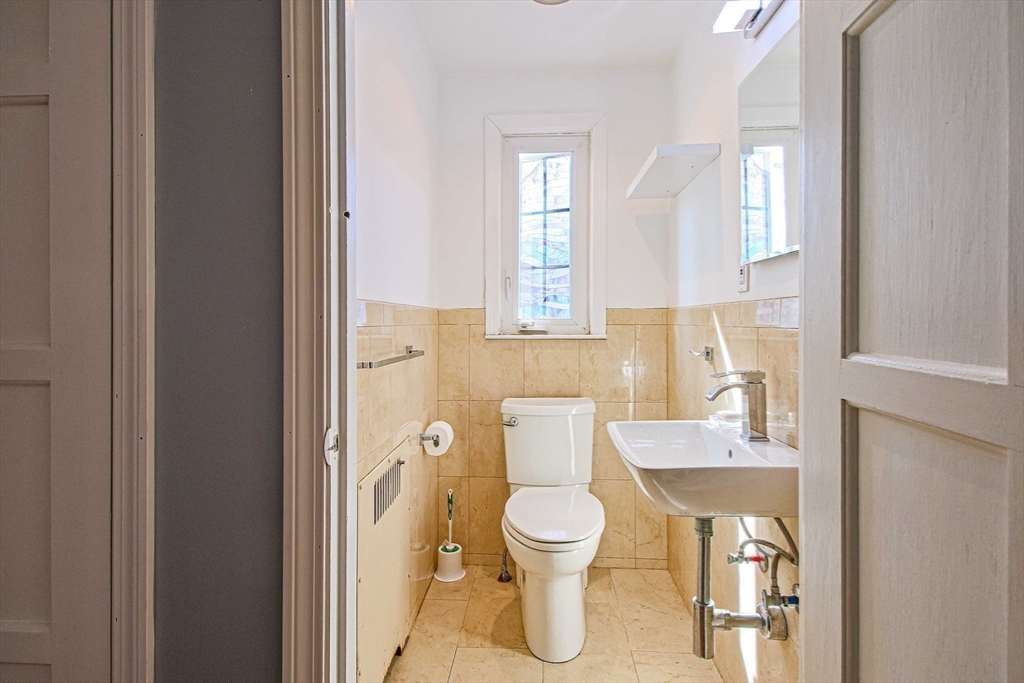 5 Old Brook Drive Worcester, MA 01609 - Photo 28 of 42 a bathroom with a toilet sink and mirror