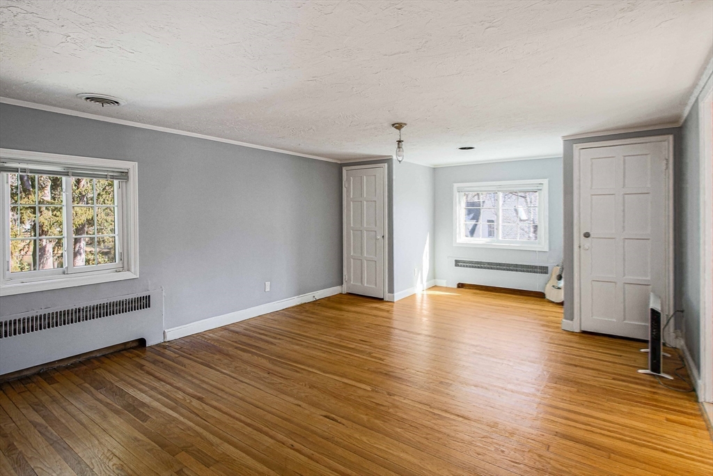 5 Old Brook Drive Worcester, MA 01609 - Photo 31 of 42 wooden floor in an empty room with a window