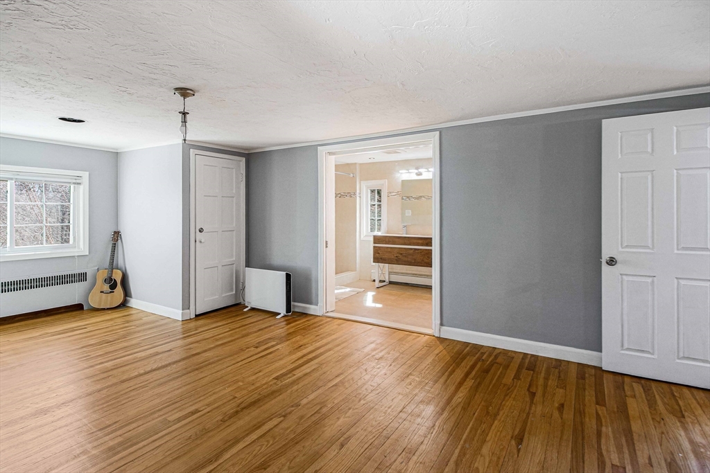 5 Old Brook Drive Worcester, MA 01609 - Photo 32 of 42 an empty room with wooden floor and windows
