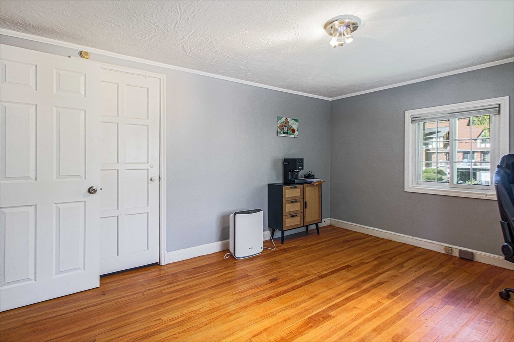 5 Old Brook Drive Worcester, MA 01609 - Photo 38 of 42 a view of empty room with wooden floor and fan