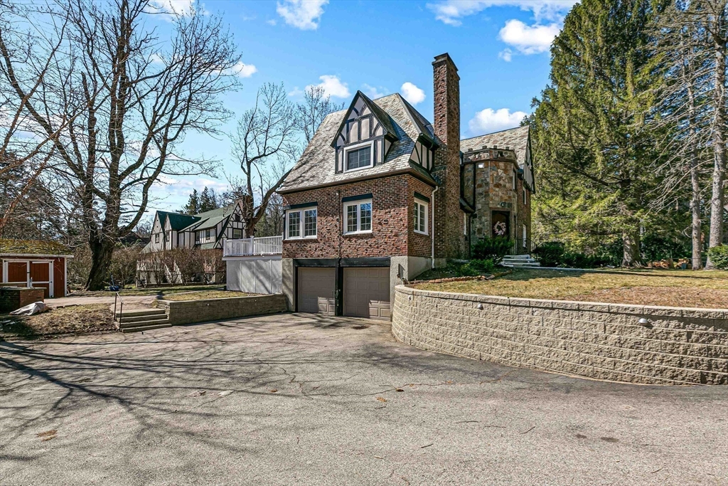 5 Old Brook Drive Worcester, MA 01609 - Photo 5 of 42 a front view of a house with a yard