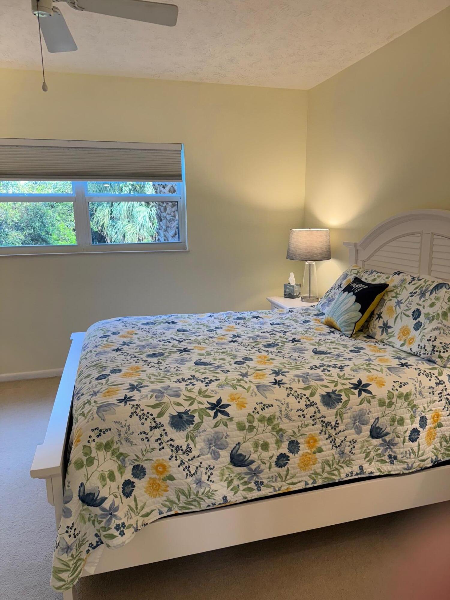 2950 Southeast Ocean Boulevard, Unit 110202 Stuart, FL 34996 - Photo 14 of 25 a bedroom with a bed