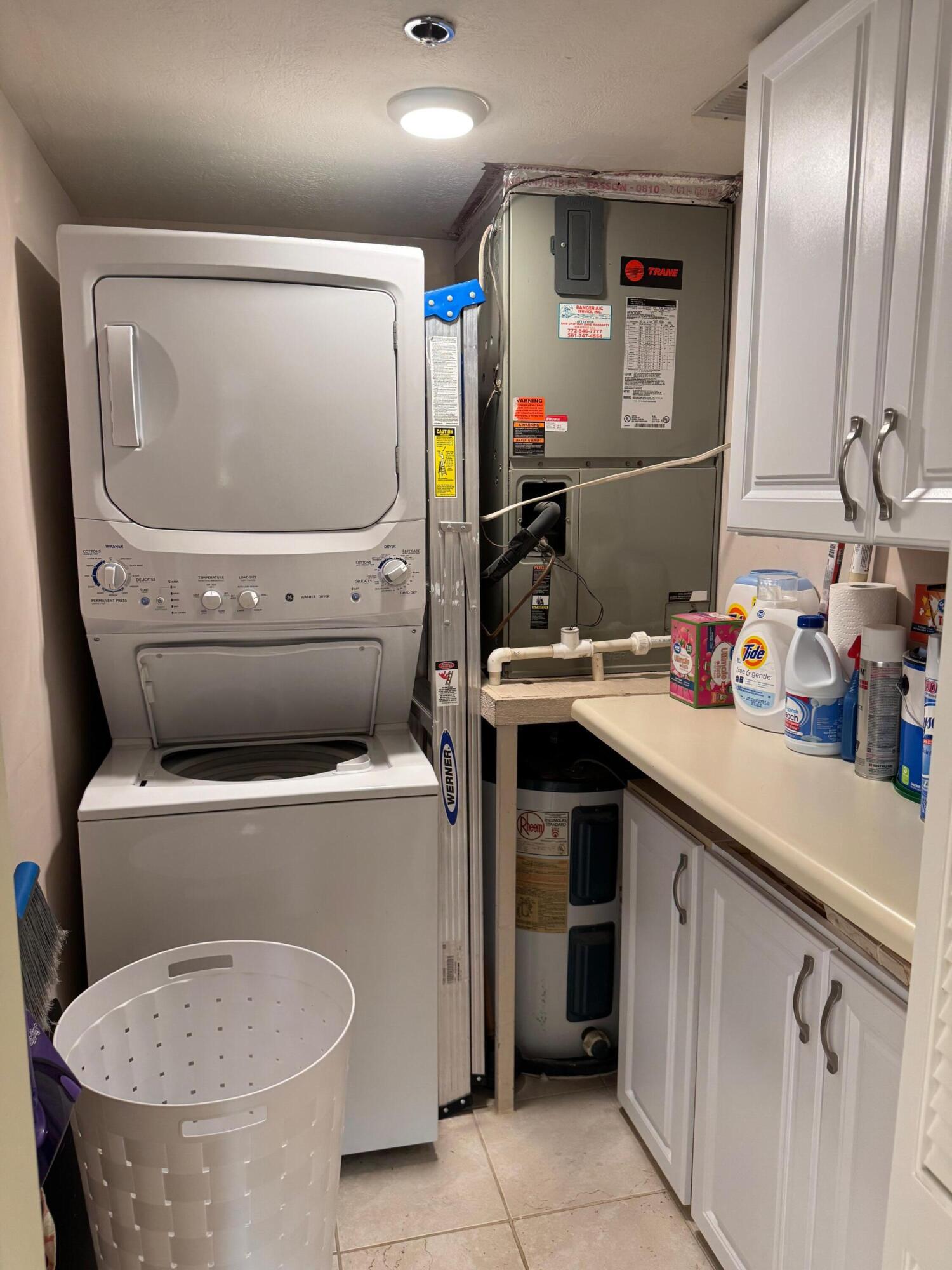 2950 Southeast Ocean Boulevard, Unit 110202 Stuart, FL 34996 - Photo 19 of 25 a utility room with dryer and washer