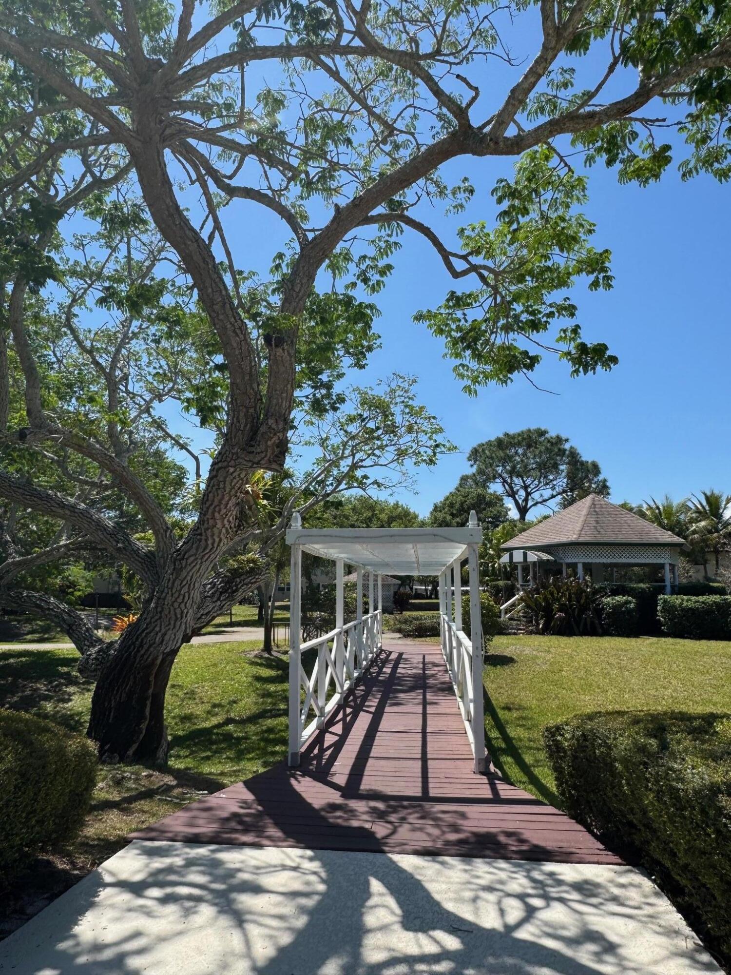 2950 Southeast Ocean Boulevard, Unit 110202 Stuart, FL 34996 - Photo 25 of 25 a front view of a house with a yard