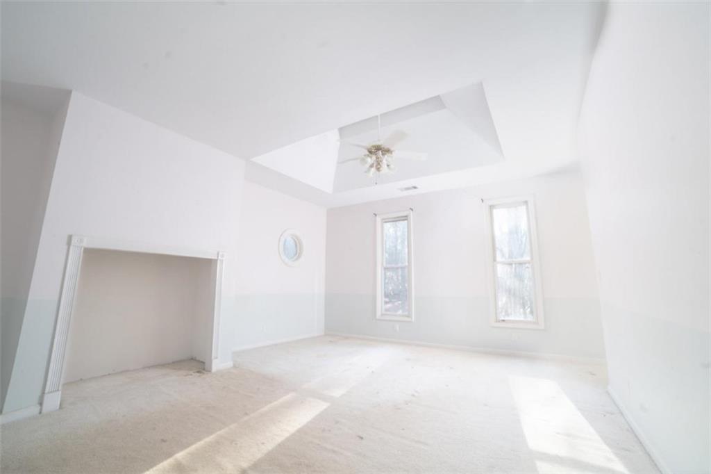 2210 Cammie Wages Road Dacula, GA 30019 - Photo 20 of 32 an empty room with windows and closet