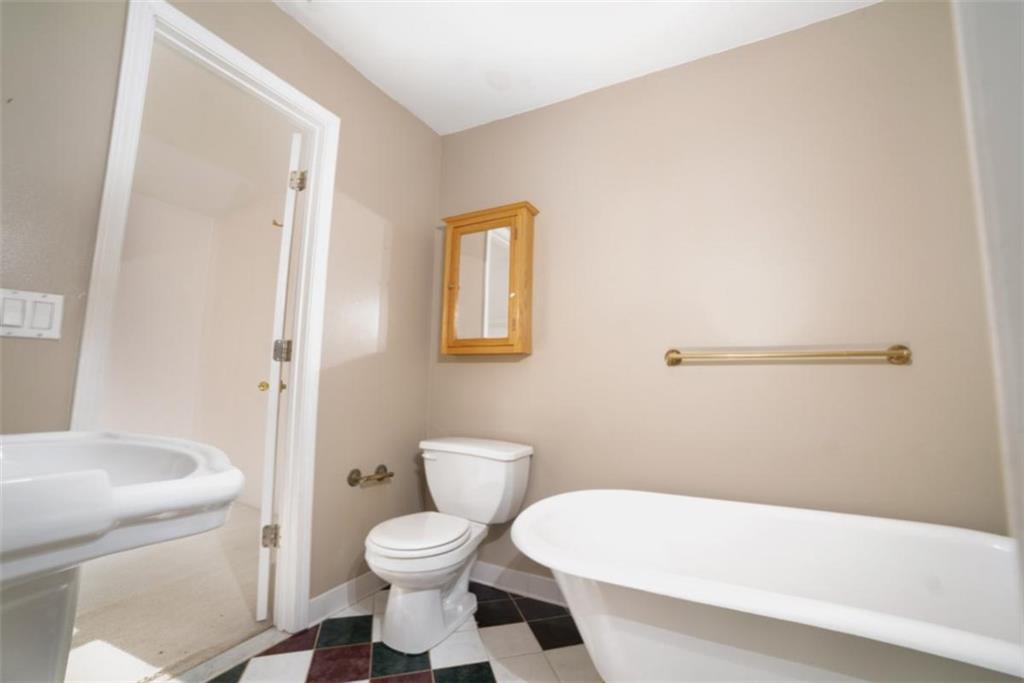 2210 Cammie Wages Road Dacula, GA 30019 - Photo 25 of 32 a bathroom with a toilet and a shower