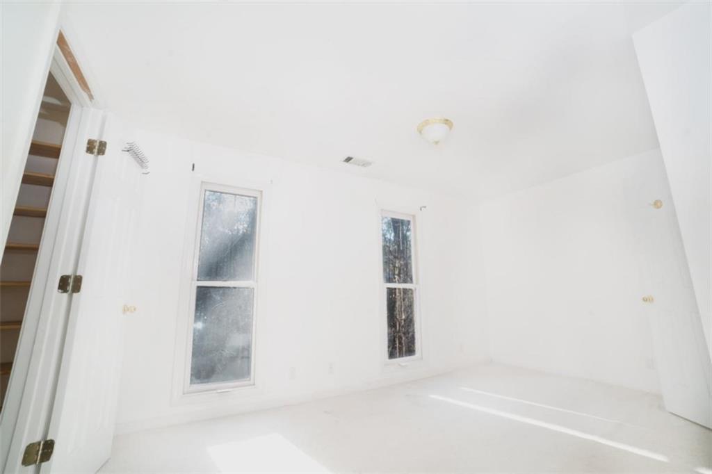 2210 Cammie Wages Road Dacula, GA 30019 - Photo 27 of 32 a bathroom with a bathtub and shower