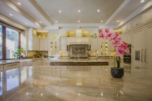 a view of kitchen with dining table and chairs