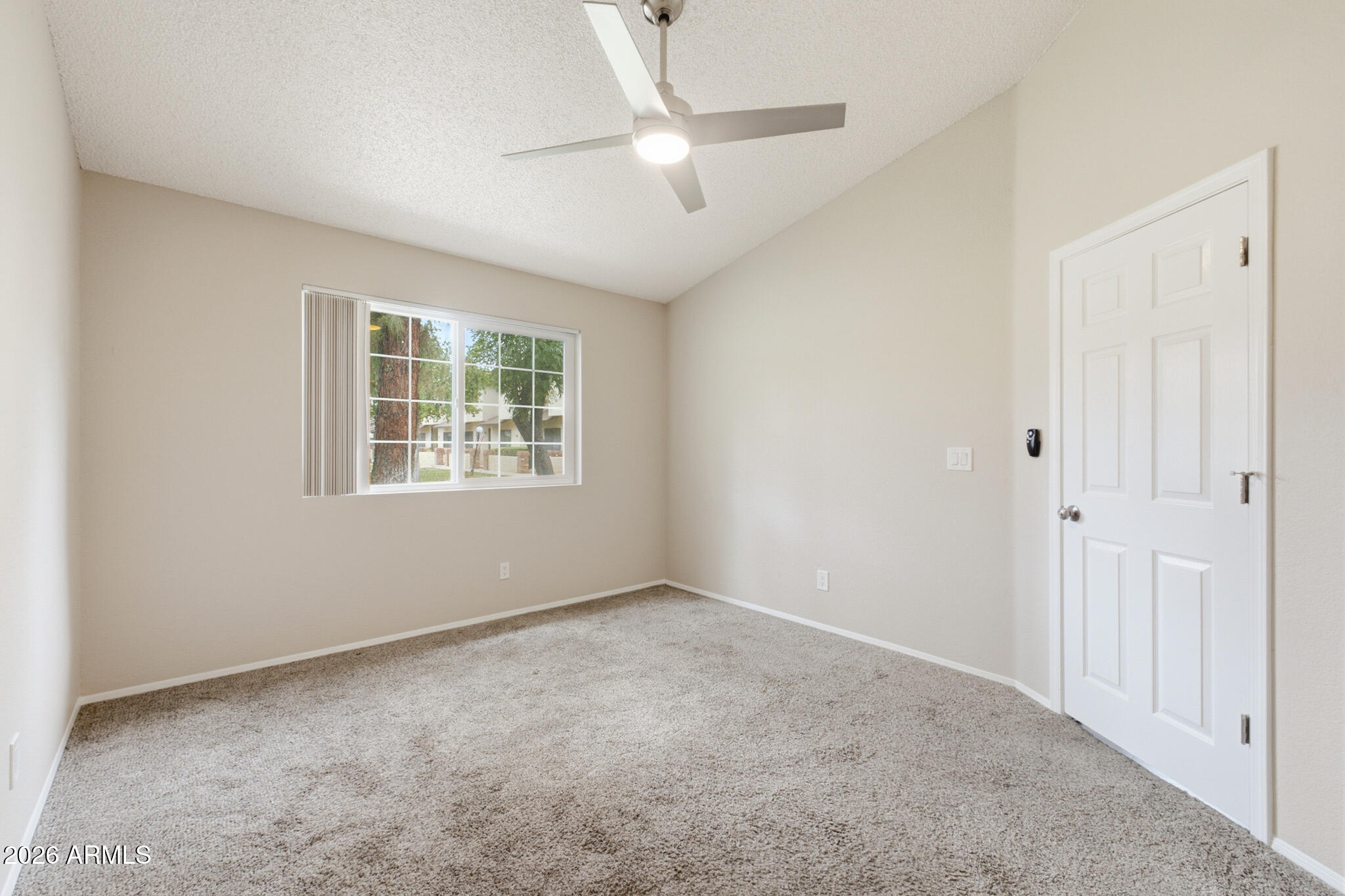 170 East Guadalupe Road, Unit 112 Gilbert, AZ 85234 - Photo 9 of 22 a view of an empty room with a window