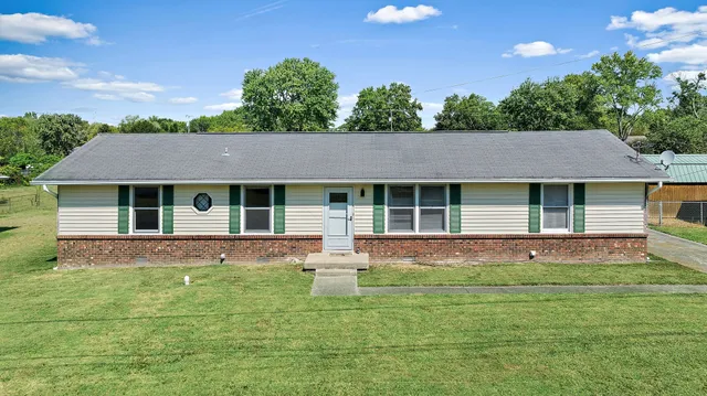 a house view with a sitting space garden and outdoor space