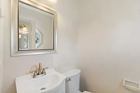 a bathroom with a sink and mirror