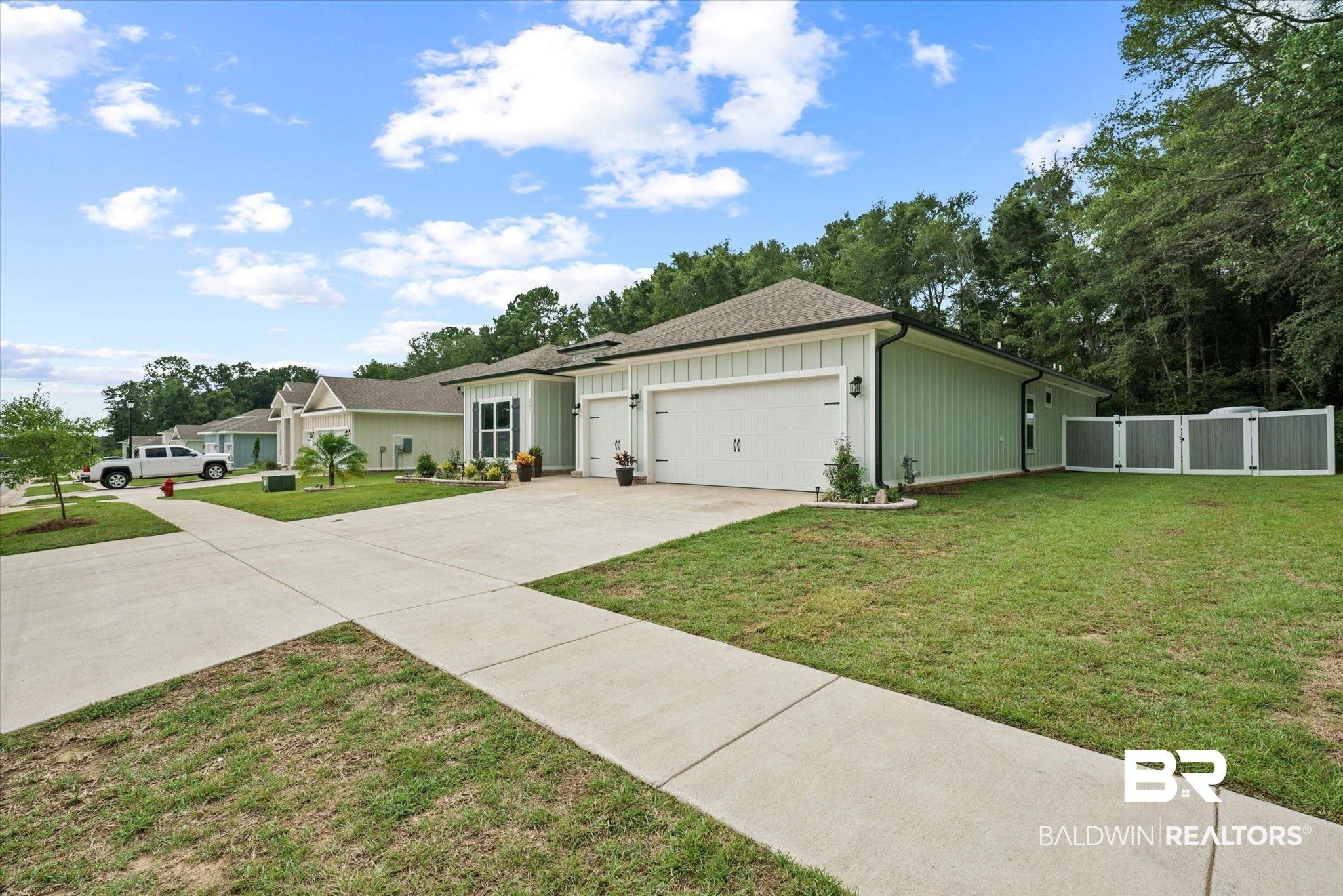 263 Bronze Street Fairhope, AL 36532 - Photo 32 of 47 Ranch-style home with a garage and a front lawn