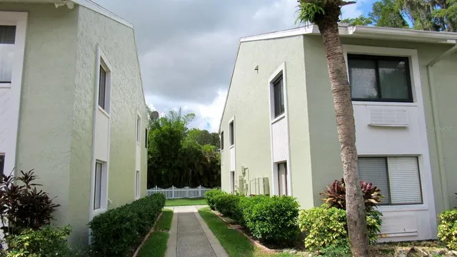 a front view of a house with a yard table and chairs