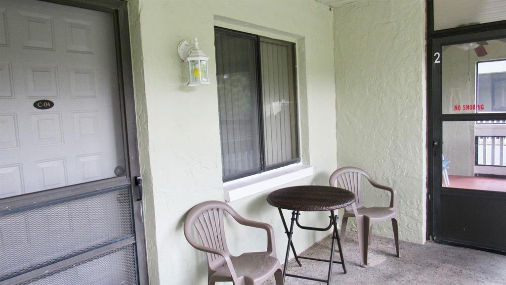 20861 Haulover Cove Road, Unit C4 Lutz, FL 33558 - Photo 15 of 22 a view of a dining room with furniture and a window