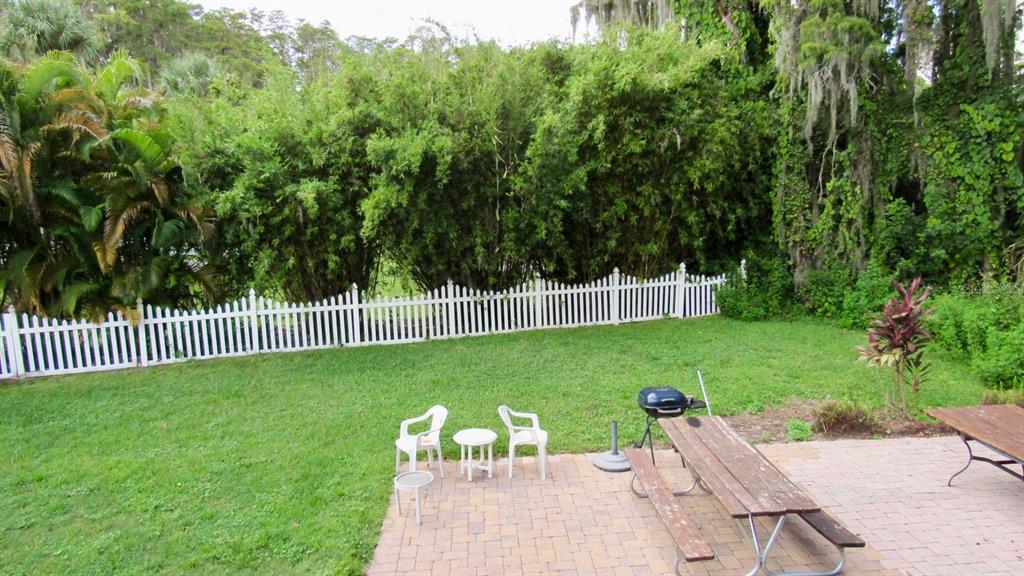 20861 Haulover Cove Road, Unit C4 Lutz, FL 33558 - Photo 18 of 22 a view of a backyard with a garden