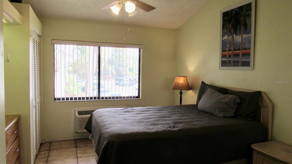 20861 Haulover Cove Road, Unit C4 Lutz, FL 33558 - Photo 6 of 22 a bedroom with a bed and a window