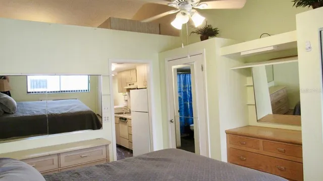a bathroom with a sink mirror and vanity