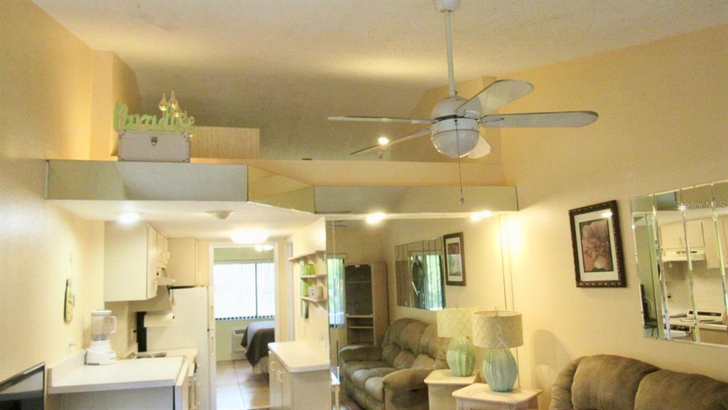 20861 Haulover Cove Road, Unit C4 Lutz, FL 33558 - Photo 8 of 22 a bathroom with a sink mirror and vanity