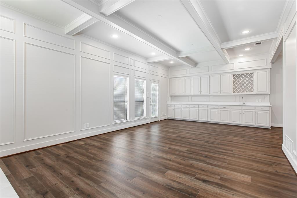 2117 Promontory Point Plano, TX 75075 - Photo 11 of 37 a view of an empty room with wooden floor and a window
