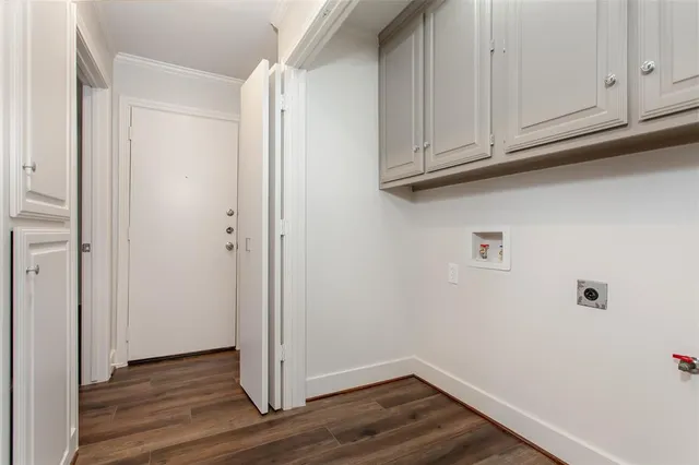 a view of cabinets and wooden floor