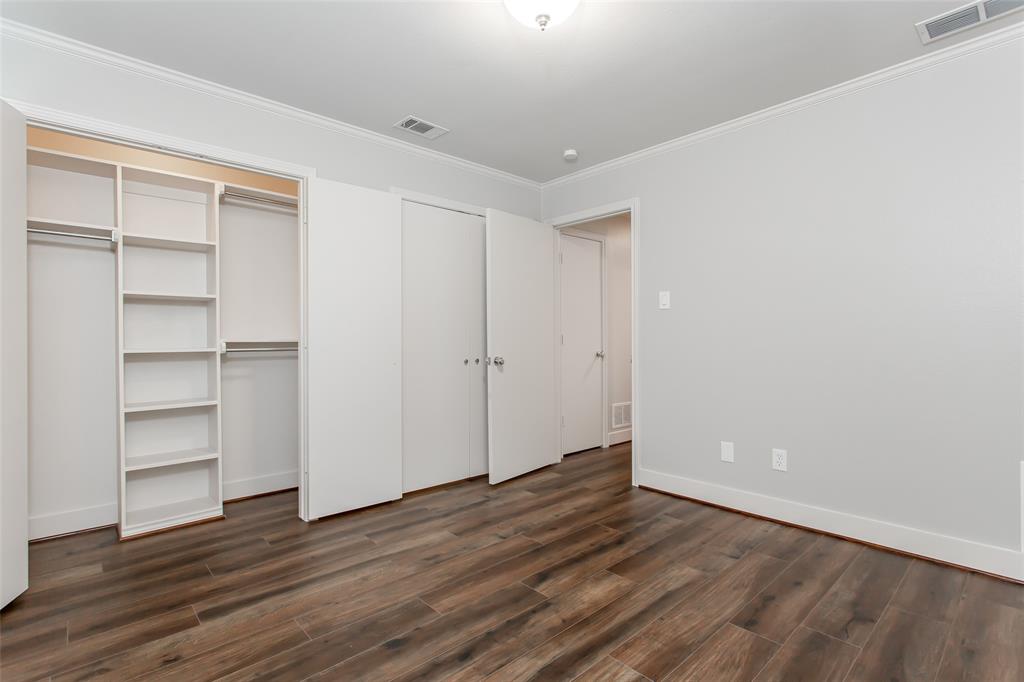 2117 Promontory Point Plano, TX 75075 - Photo 22 of 37 a view of an empty room with a window and wooden floor