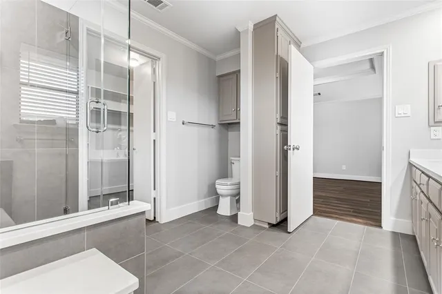 a bathroom with a sink and a large mirror