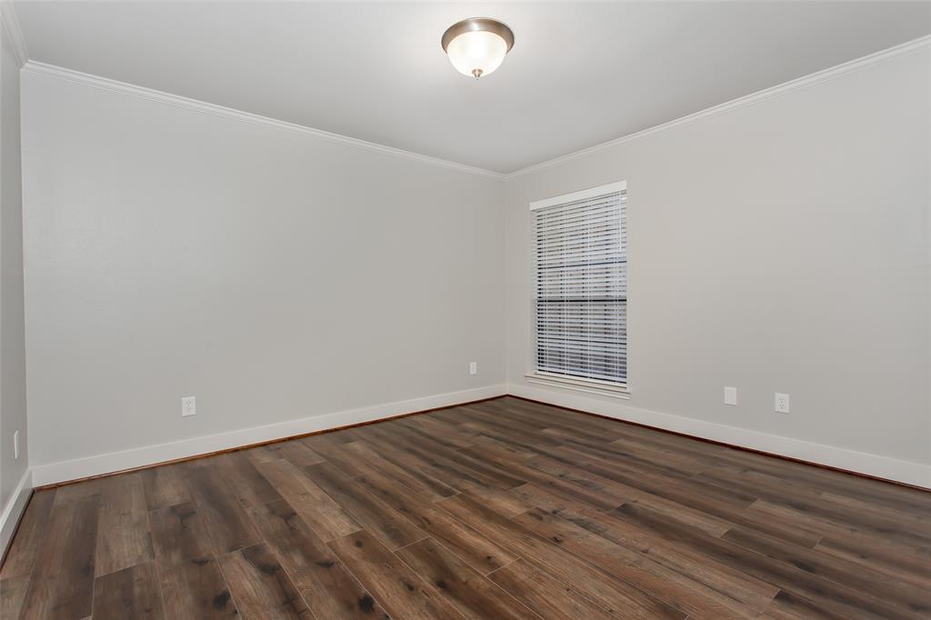 2117 Promontory Point Plano, TX 75075 - Photo 30 of 37 a view of an empty room with wooden floor and a window