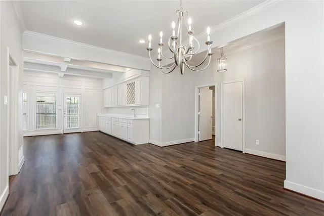 a view of a room with wooden floor and window