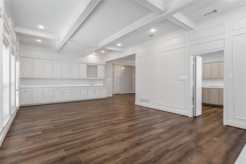 2117 Promontory Point Plano, TX 75075 - Photo 10 of 37 a view of an empty room with wooden floor closet and windows